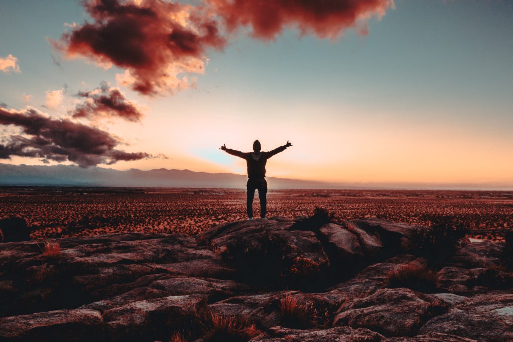 Man raising his arms in praise. Find your calling